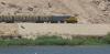 Egyptian National Railways train with EMD G22W AC locomotive 3996 on the Luxor -Aswan line on the banks of the river Nile between Edfu and Kom Ombo., foto: Ad Meskens